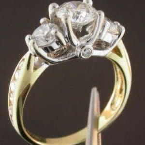 Three Stone Engagement Ring with Smaller Diamonds to the Side