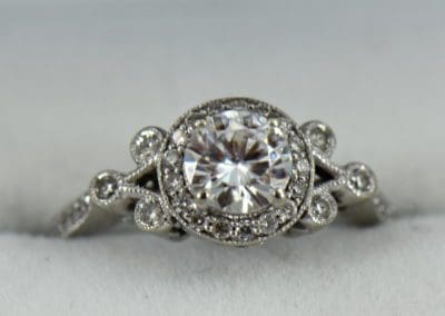Custom vintage style moissanite halo ring in white gold