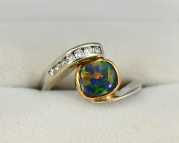 Barb s Custom Black Opal Diamond Bypass Ring.JPG