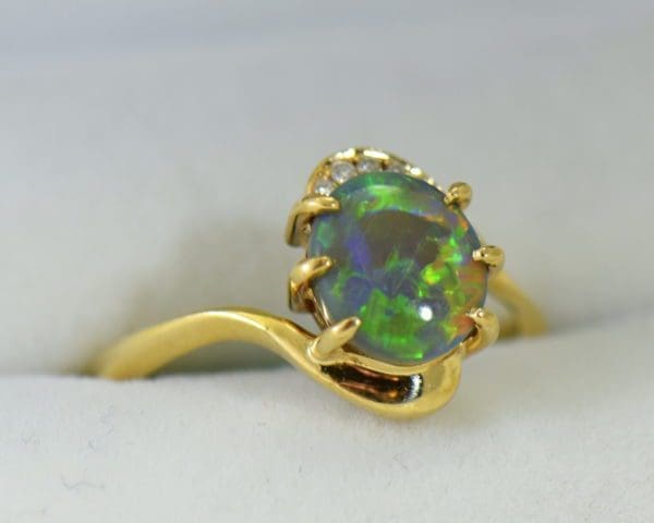Australian Semi Black Opal set in Yellow Gold Bypass Ring Mounting with Diamond Accents 6.JPG