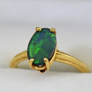 Chinese Writing Pattern Black Opal set in Orange Blossom Yellow Gold Solitaire circa 1930.JPG