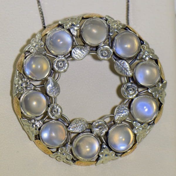 large 1930s floral wreath pendant with blue moonstones in sterling and 14k 3.JPG