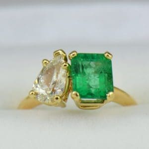 G Modern Two Stone Ring with Pear Diamond Emerald Cut Emerald yellow gold.JPG