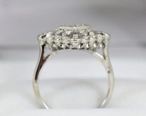Vintage Diamond Ring with Center Diamond and Surrounding Filigree Patterns