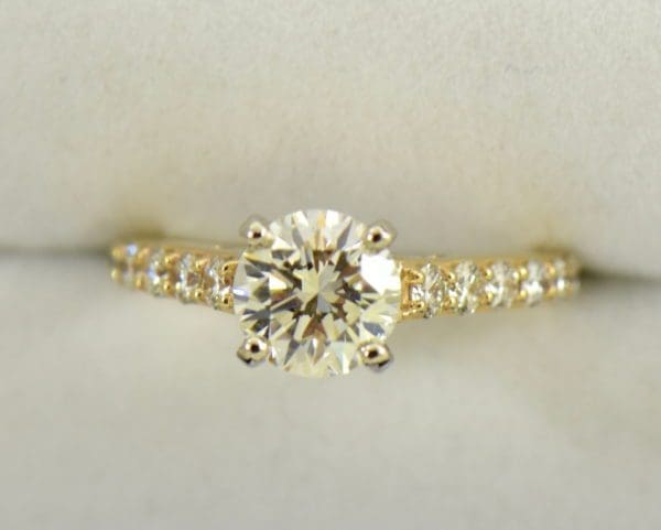 Yellow Gold accented solitaire engagement ring with 1.50ct vs kl round diamond
