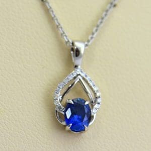Dainty Blue Sapphire Diamond Embrace Pendant.JPG