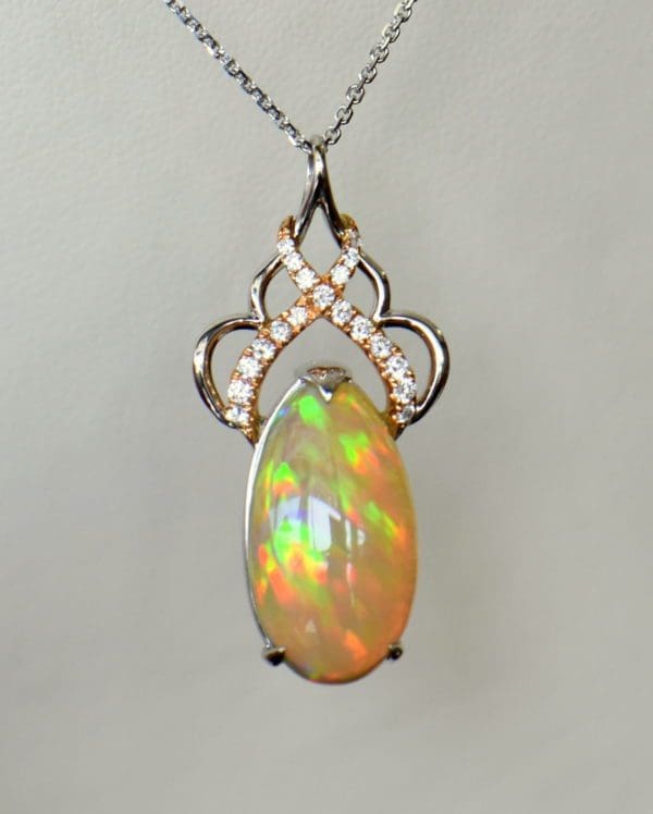 Ethiopian Crystal fire opal pendant with snakeskin pattern prismatic color rose gold 2.JPG