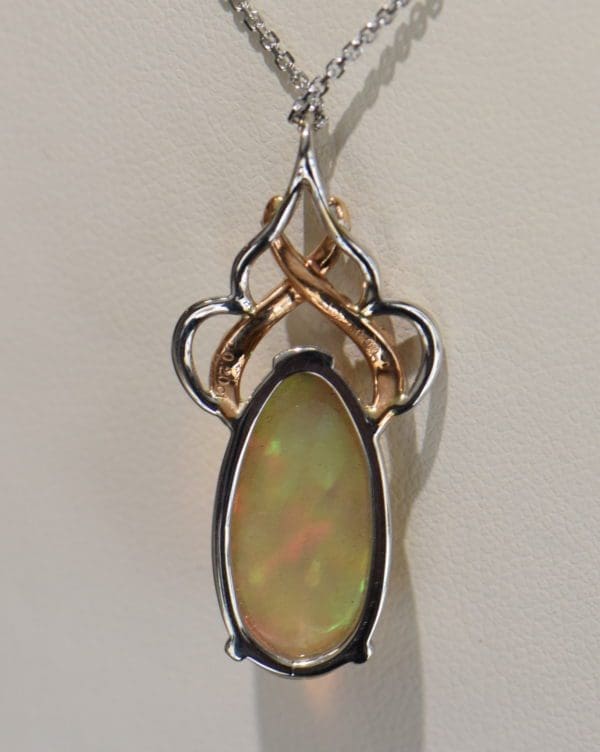 Ethiopian Crystal fire opal pendant with snakeskin pattern prismatic color rose gold 5.JPG