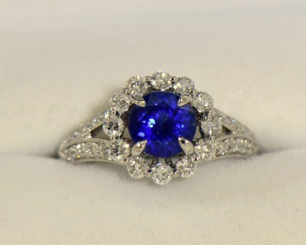 Round blue sapphire diamond halo engagement ring in white gold.JPG