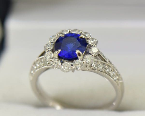 Round blue sapphire diamond halo engagement ring in white gold 6.JPG