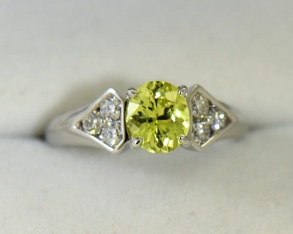 golden yellow chrysoberyl engagement ring with diamond shield accents.JPG