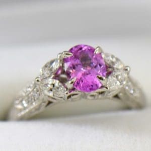 orchid pink sapphire and marquise diamond engangement ring in carved white gold.JPG