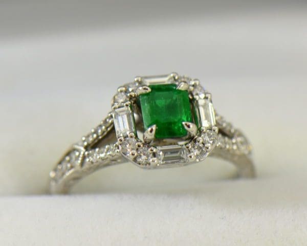 radiant cut natural emerald in baguette diamond halo engagement ring.JPG