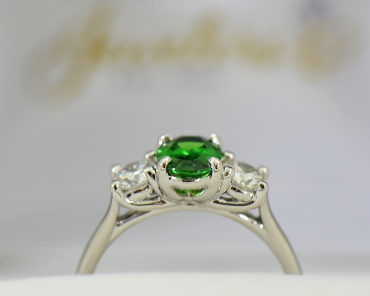 white gold three stone ring with diamonds and oval tsavorite green garnet 3.JPG