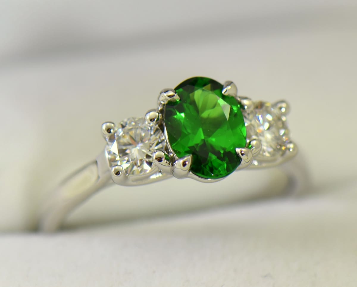 white gold three stone ring with diamonds and oval tsavorite green garnet 5.JPG