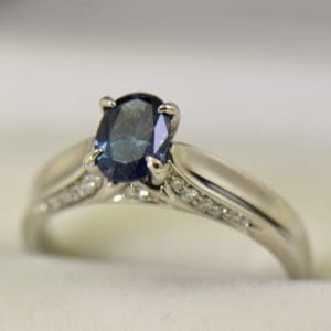 blue garnet engagement ring with madagascar color change garnet and diamonds.JPG