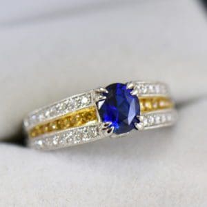 unheated royal blue sapphire ring with yellow and white diamond accents 2.JPG