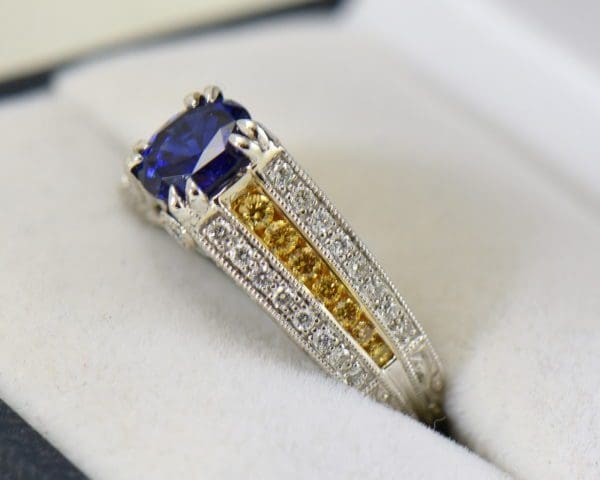 unheated royal blue sapphire ring with yellow and white diamond accents 3.JPG