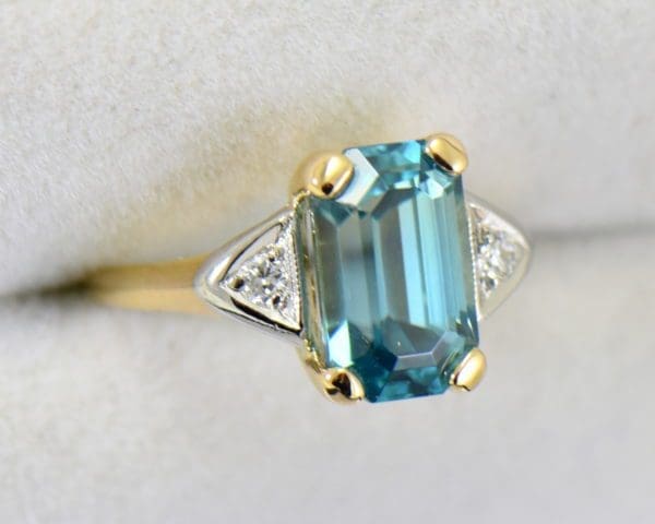 emerald cut blue zircon 3 stone ring in deco mounting 2.JPG