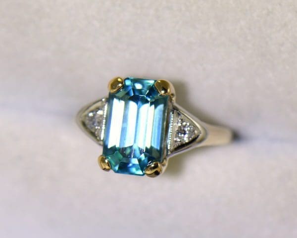 emerald cut blue zircon 3 stone ring in deco mounting 4.JPG