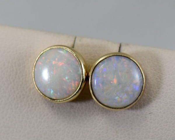 vintage australian opal stud earrings in milgrained yellow gold bezels.JPG