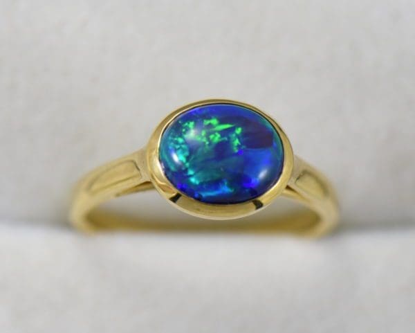 yellow gold solitaire black opal engagement ring with blue green color 4.JPG