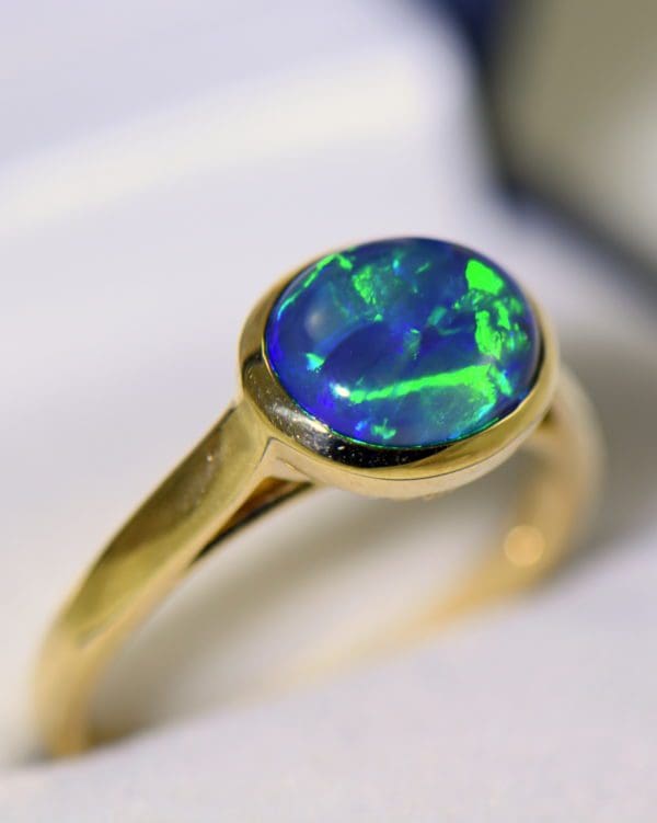 yellow gold solitaire black opal engagement ring with blue green color 5.JPG