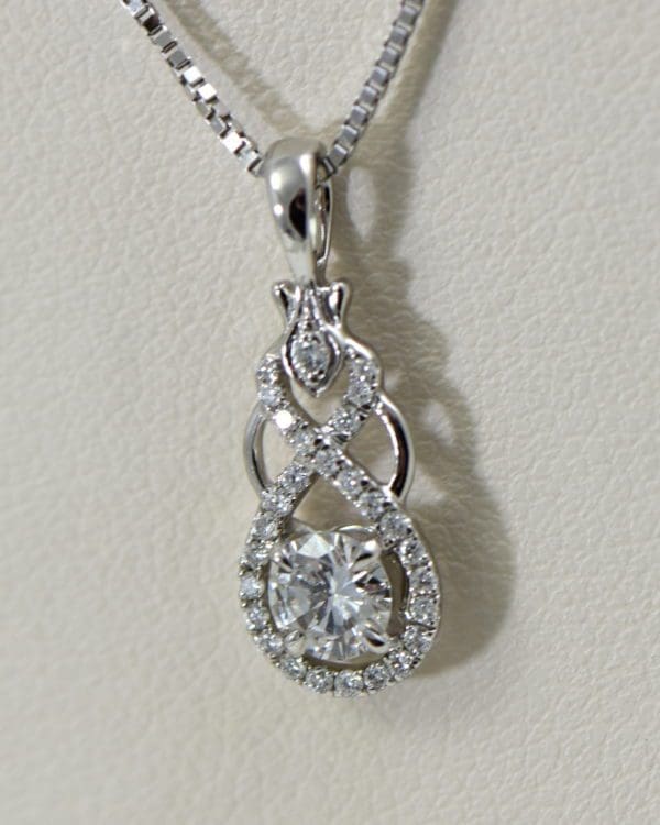 custom white gold and diamond pendant with .25ct diamond center 2.JPG
