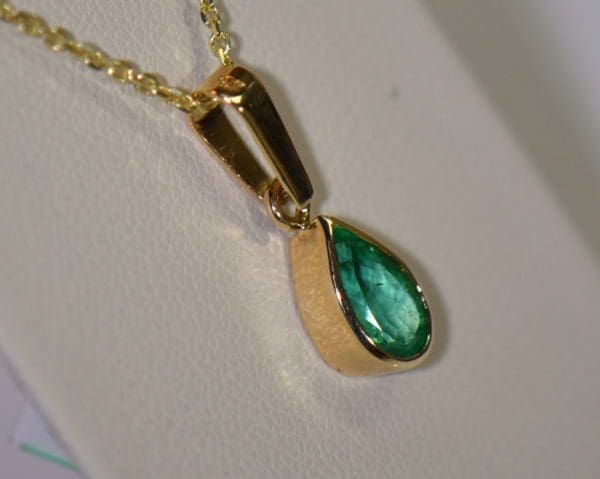 1ct pear colombian emerald pendant bezel set in 18k gold 2.JPG