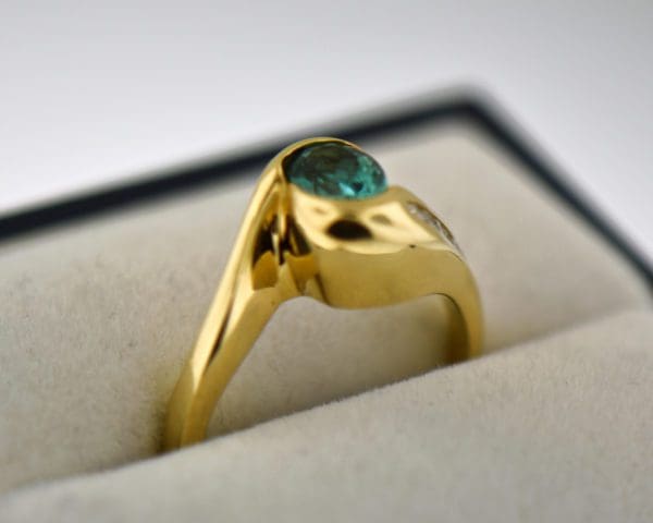 custom 18k yellow gold swirl ring with bezel set teal tourmaline 3