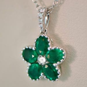 gem quality natural emerald flower pendant with diamonds