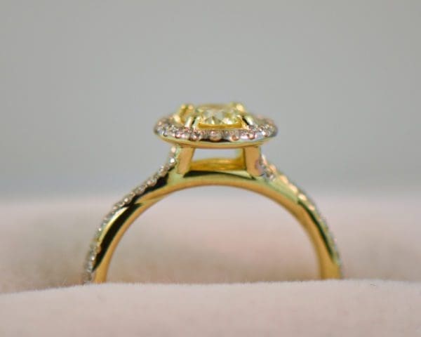 round yellow diamond engagement ring in yellow gold halo mounting 4