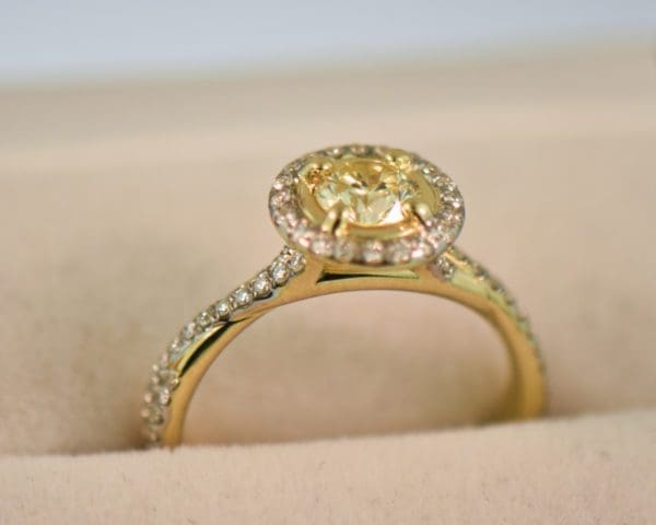 round yellow diamond engagement ring in yellow gold halo mounting 6
