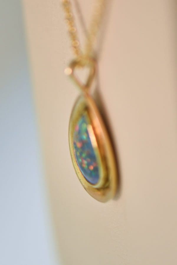 vintage gold pendant bezel set with gem grade black opal 3