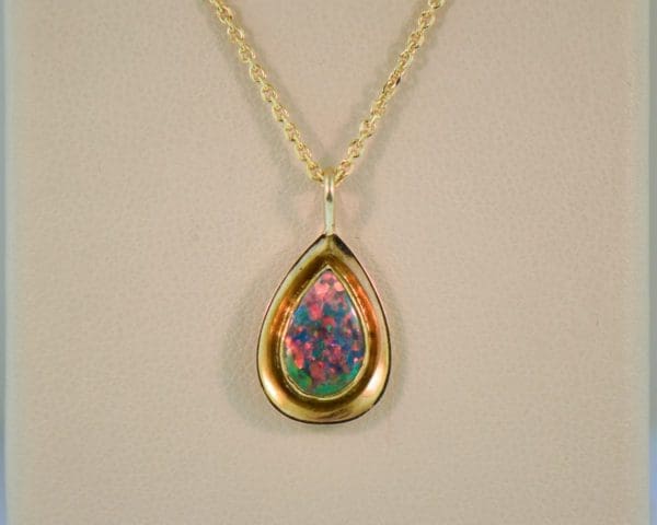 vintage gold pendant bezel set with gem grade black opal 7
