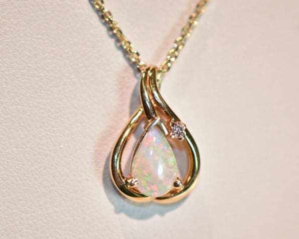modern estate white pear shaped opal and diamond pendant 3