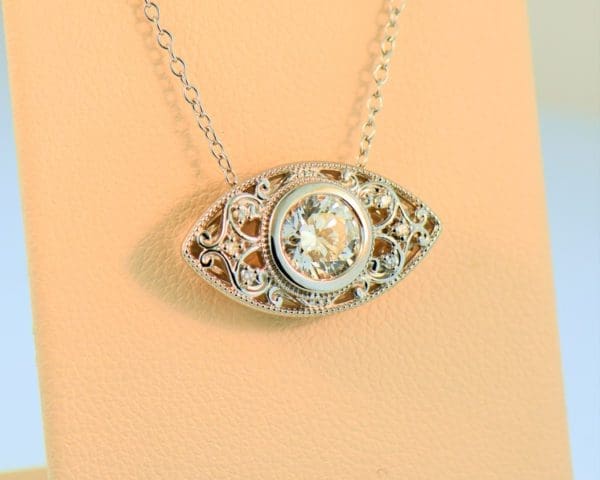 1ct round diamond eye pendant in white gold filigree 5