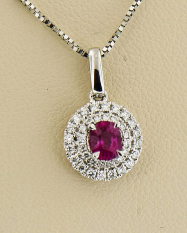 classic ruby and diamond double halo pendant