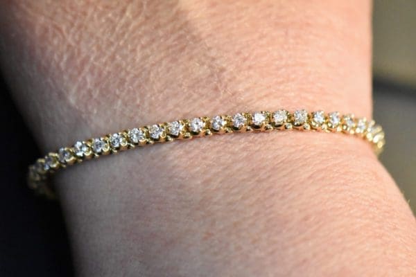 extra fine yellow gold and diamond three prong tennis bracelet 2