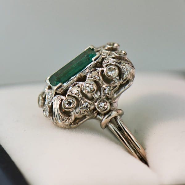 vintage platinum ring with filigree diamonds and elongated emerald 3