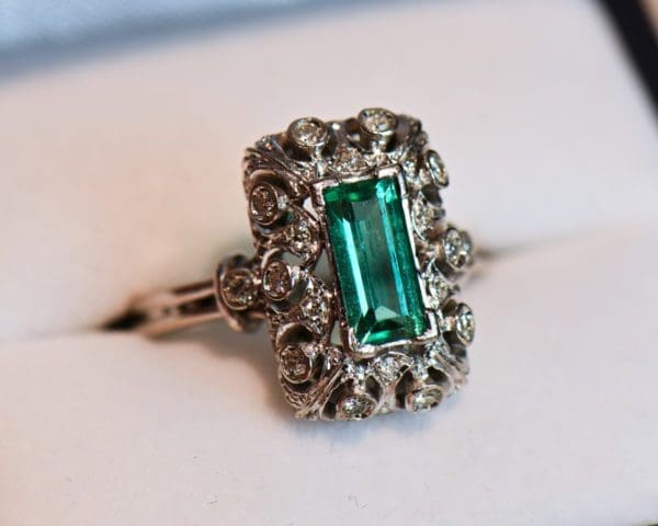 vintage platinum ring with filigree diamonds and elongated emerald 5