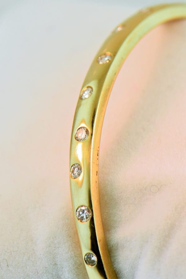 hinged gold bangle bracelet with gypsy set diamonds 2