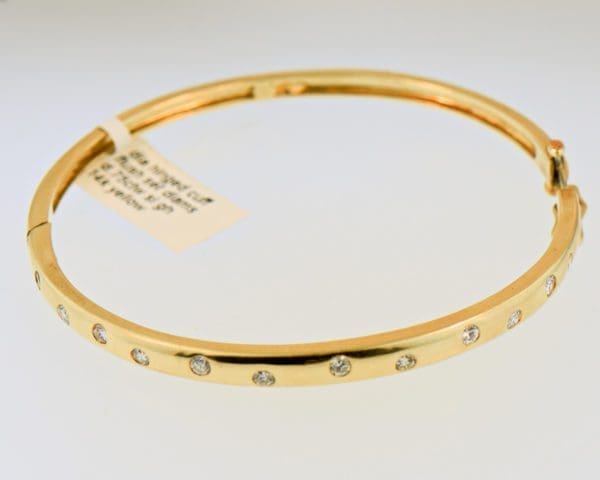 hinged gold bangle bracelet with gypsy set diamonds 4
