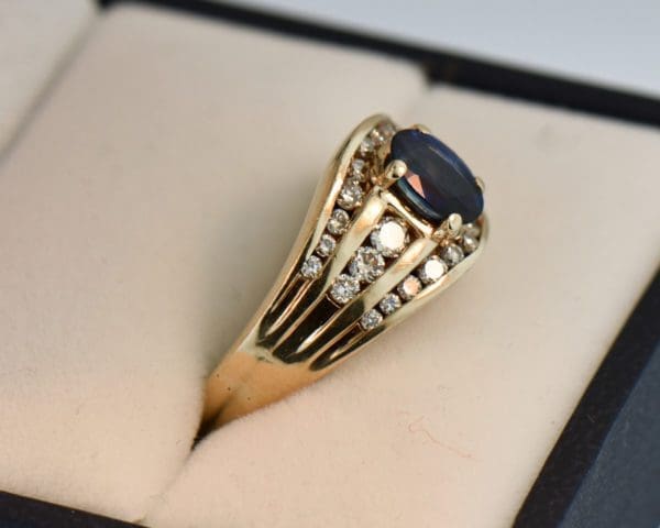 yellow gold channel set diamond and navy blue sapphire estate ring 2