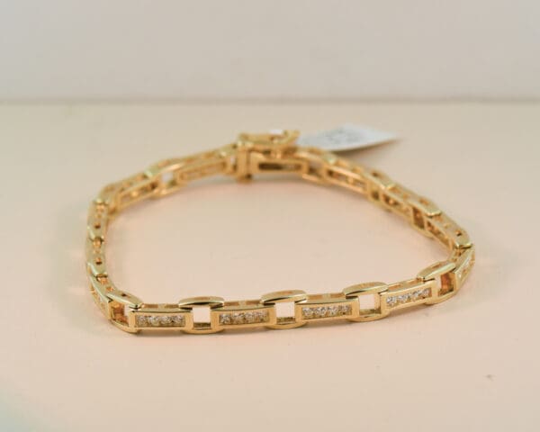 channel set yellow gold and 2ct diamond tennis bracelet 4