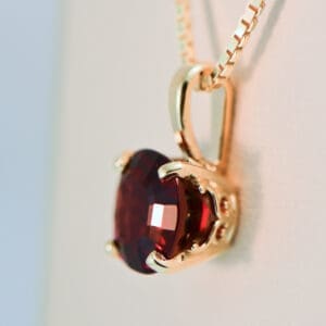 cushion cut red garnet solitaire pendant in gold