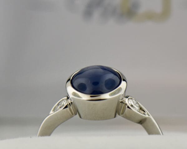 custom round burmese blue star sapphire bezel set engagement ring 3