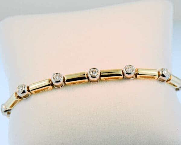 bezel set diamond and gold link twotone tennis bracelet