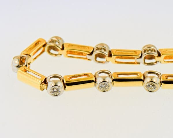 bezel set diamond and gold link twotone tennis bracelet 4