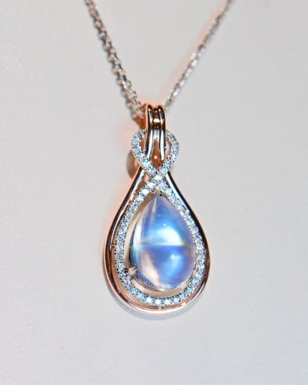 custom rose gold pear pendant with blue moonstone and diamonds 3